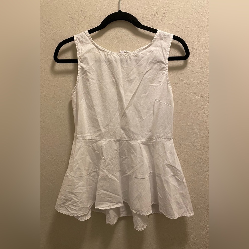 White Cremieux Peplum Sleeveless Blouse
